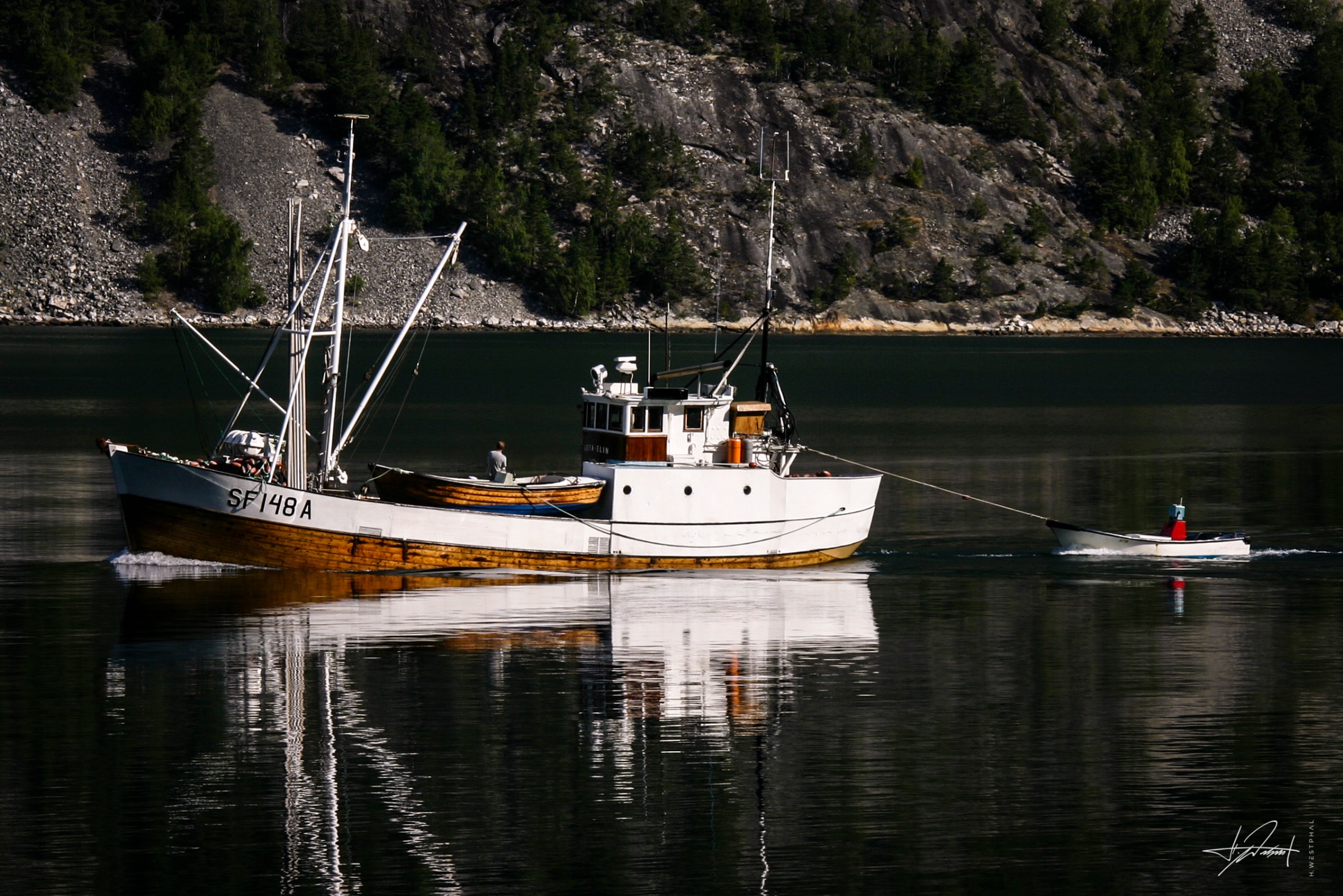 Wooden fishing boat on a fjord, Norway